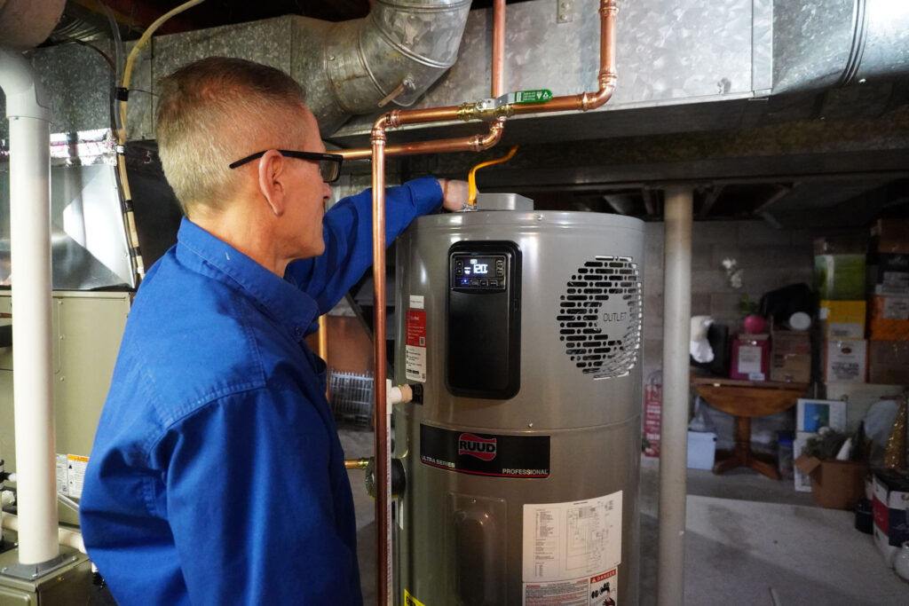 technician repairing a hot water system