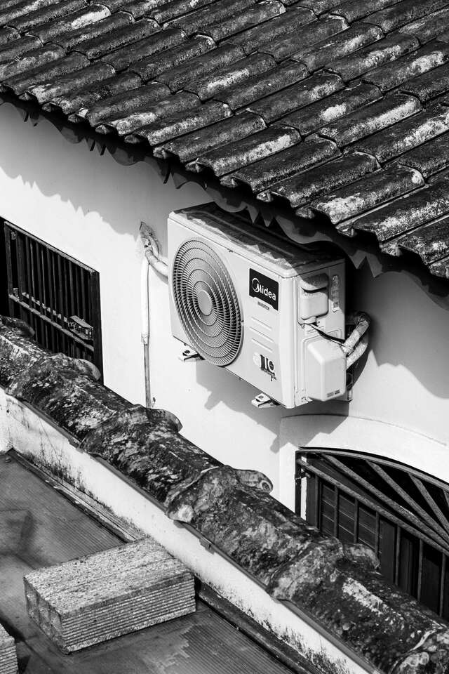 midea hot water system outside a house