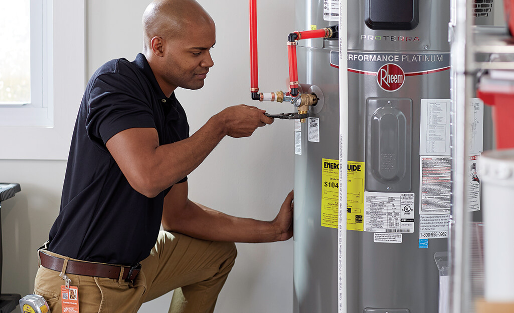 guy fixing hot water system